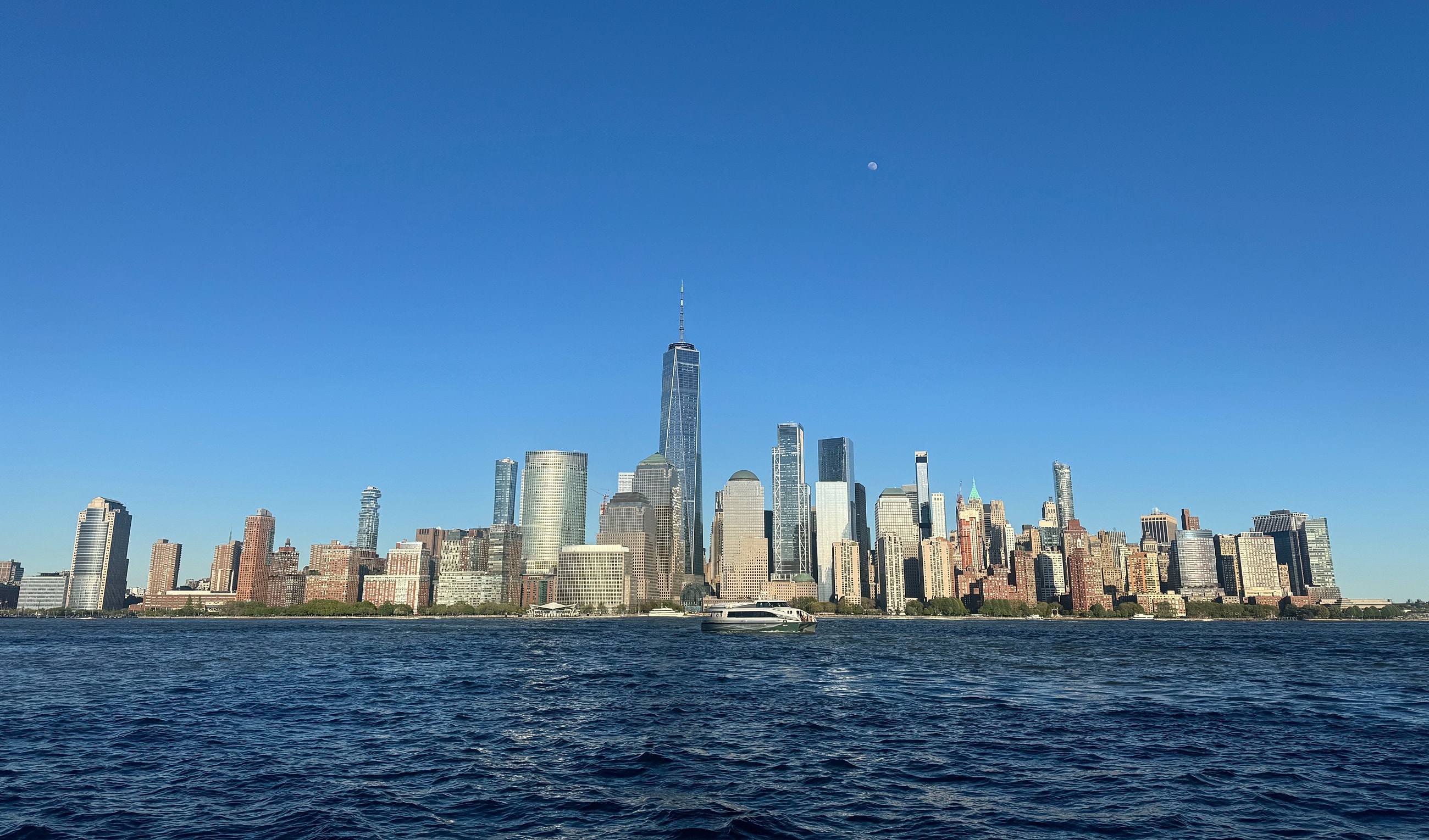 New York City skyline with water foreground.