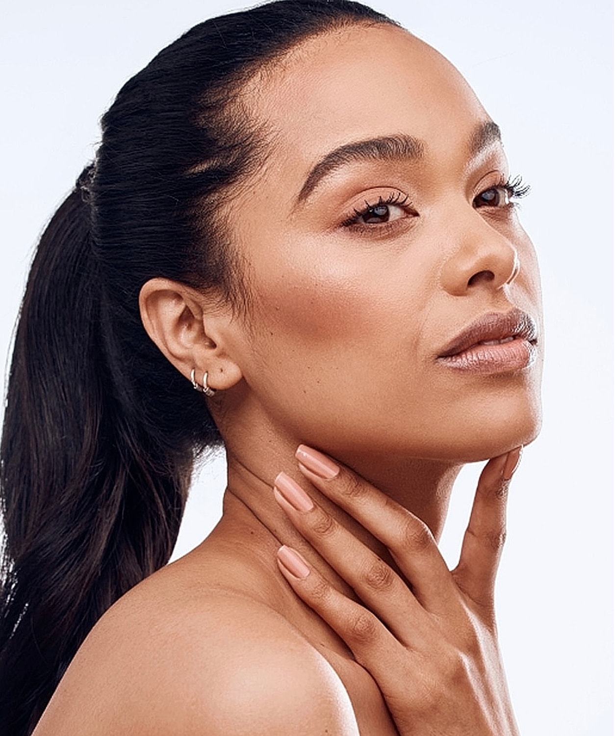 Woman with natural makeup and smooth skin.