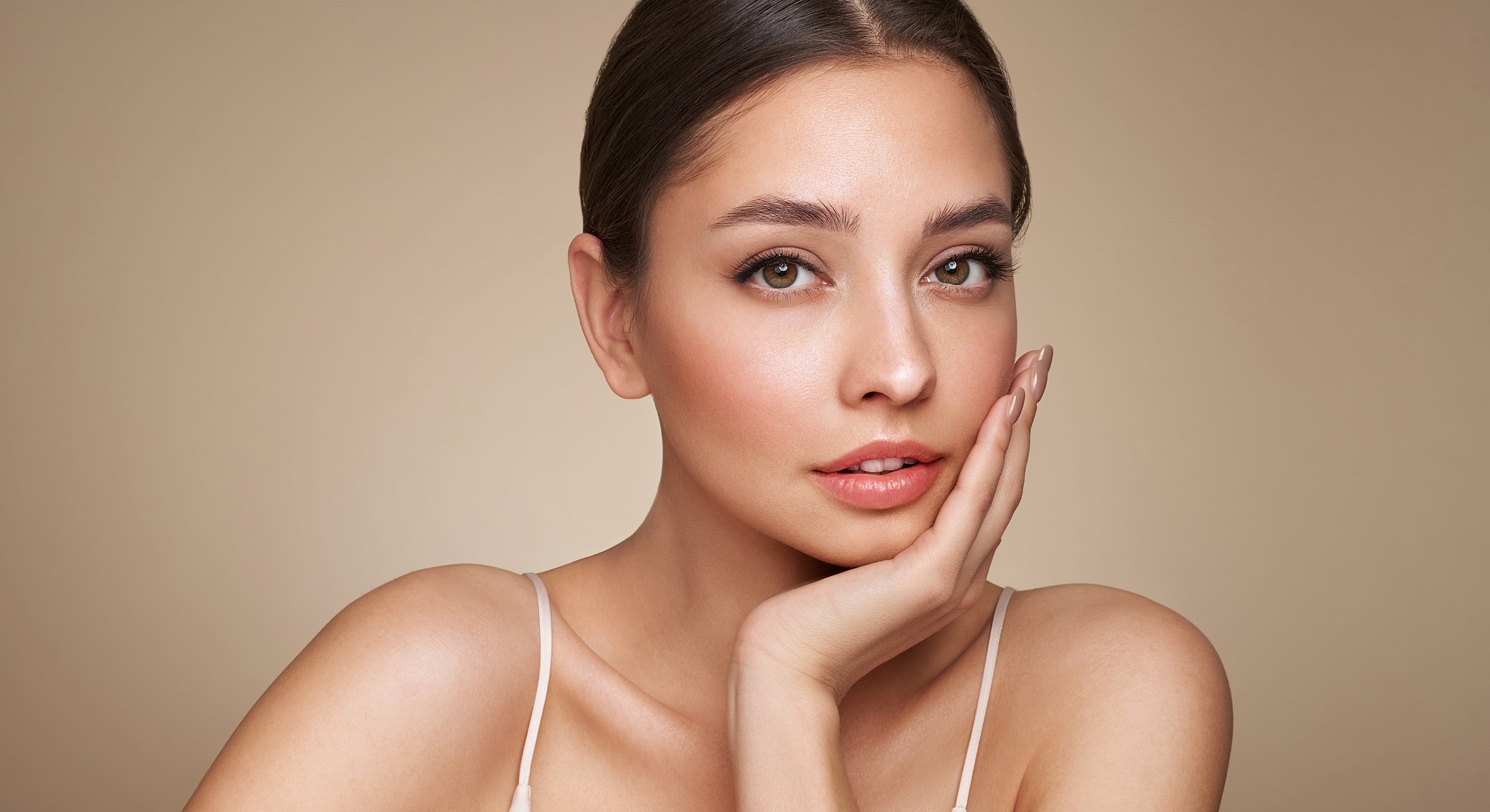 Woman with natural makeup and soft lighting.